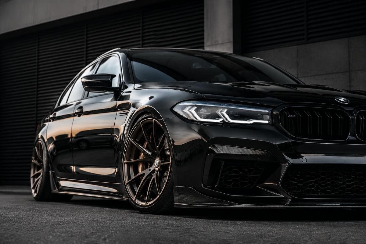 Aggressive face concave wheels mounted on a performance luxury car