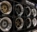 High-quality deep dish wheels with concave and lip designs displayed on a showroom rack